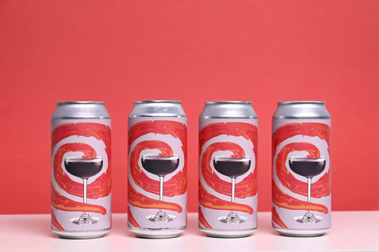 Four cans of Northern Spirits French Martini Pale Ale with vibrant red swirl design on a red background.