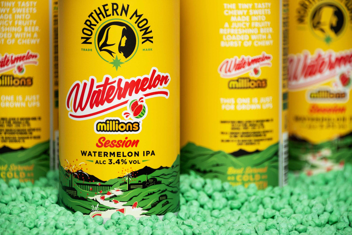 Northern Monk Watermelon Session IPA 3.4% cans surrounded by chewy sweets, featuring vibrant yellow and green packaging design.